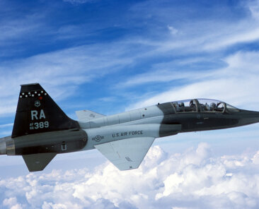 Aerial view of an USAF T-38 Talon aircraft from 560th Flying Training Squadron, Randolph AFB, TX flying over clouds.